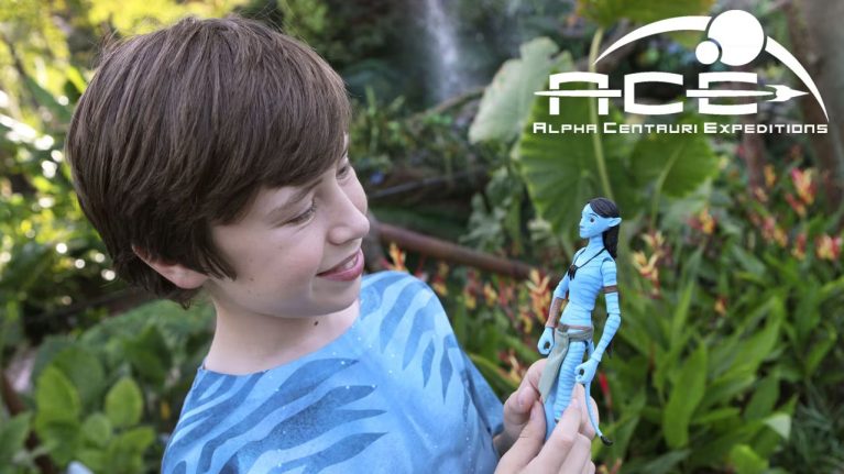 Guest Smiling with Create Your Own Avatar Action Figure at ACE Avatar Maker in Pandora – The World of Avatar