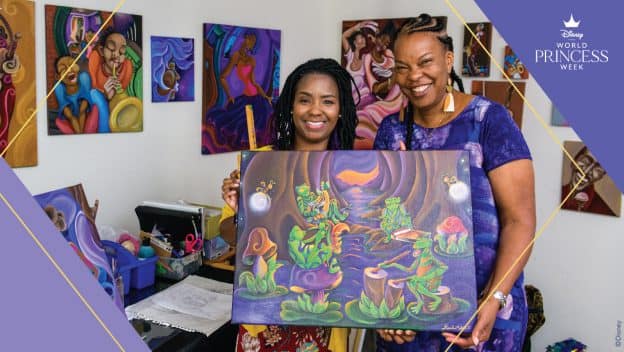 Sharika Mahdi and Charita Carter pose with art inspired by Princess and the Frog