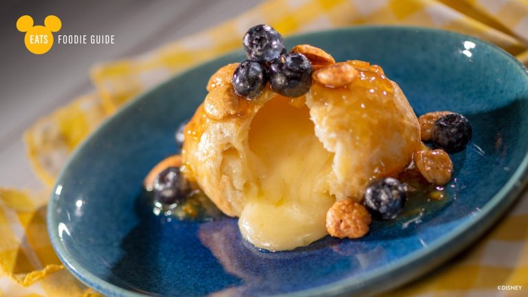 Citrus Baked Brie with preserved lemon marmalade, limoncello-macerated blueberries, and spiced marcona almonds