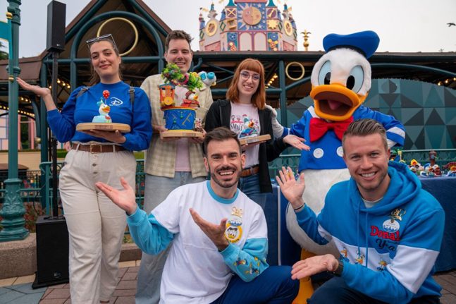 Cast members at Disneyland Paris pose with Donald Duck
