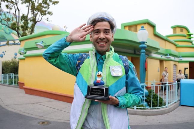 A cast member smiles with his “Most Like Donald Duck” prize