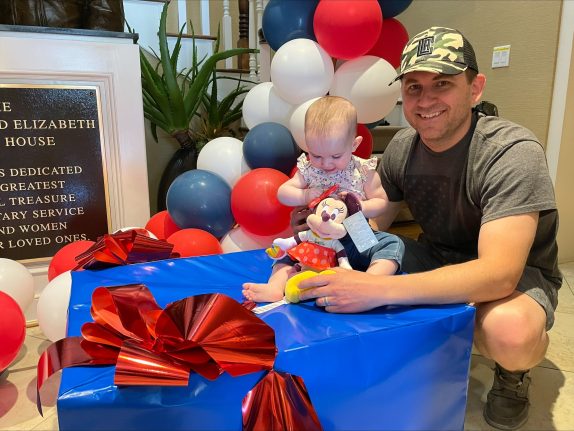 : A veteran family staying at the Fisher House Sacramento enjoying some of the Disney product inside the special care packages