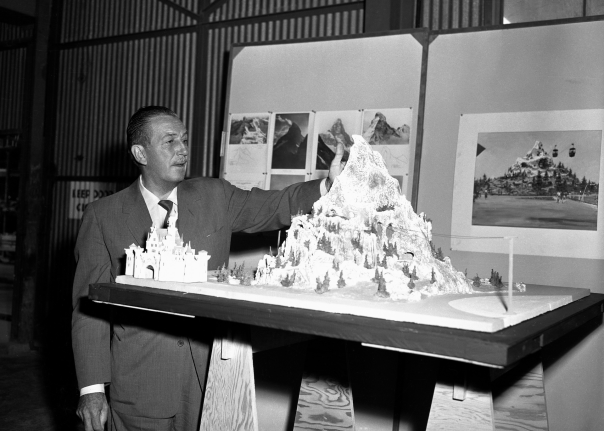 Walt Disney with a model of the Matterhorn Bobsleds Disneyland attraction