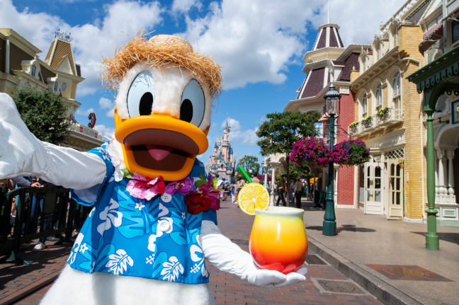 Donald Duck with drink in tropical attire at Disneyland Paris