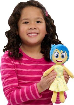 Girl smiling with Joy plush