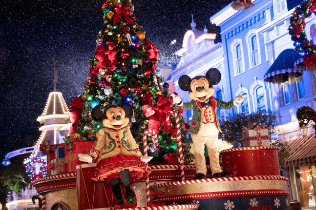 Mickey and Minnie on a float in the Mickey’s Once Upon a Christmastime Parade in Magic Kingdom