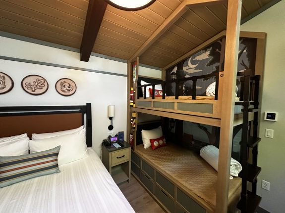 The bedroom sleeps four, enriched with rustic charm and character details.