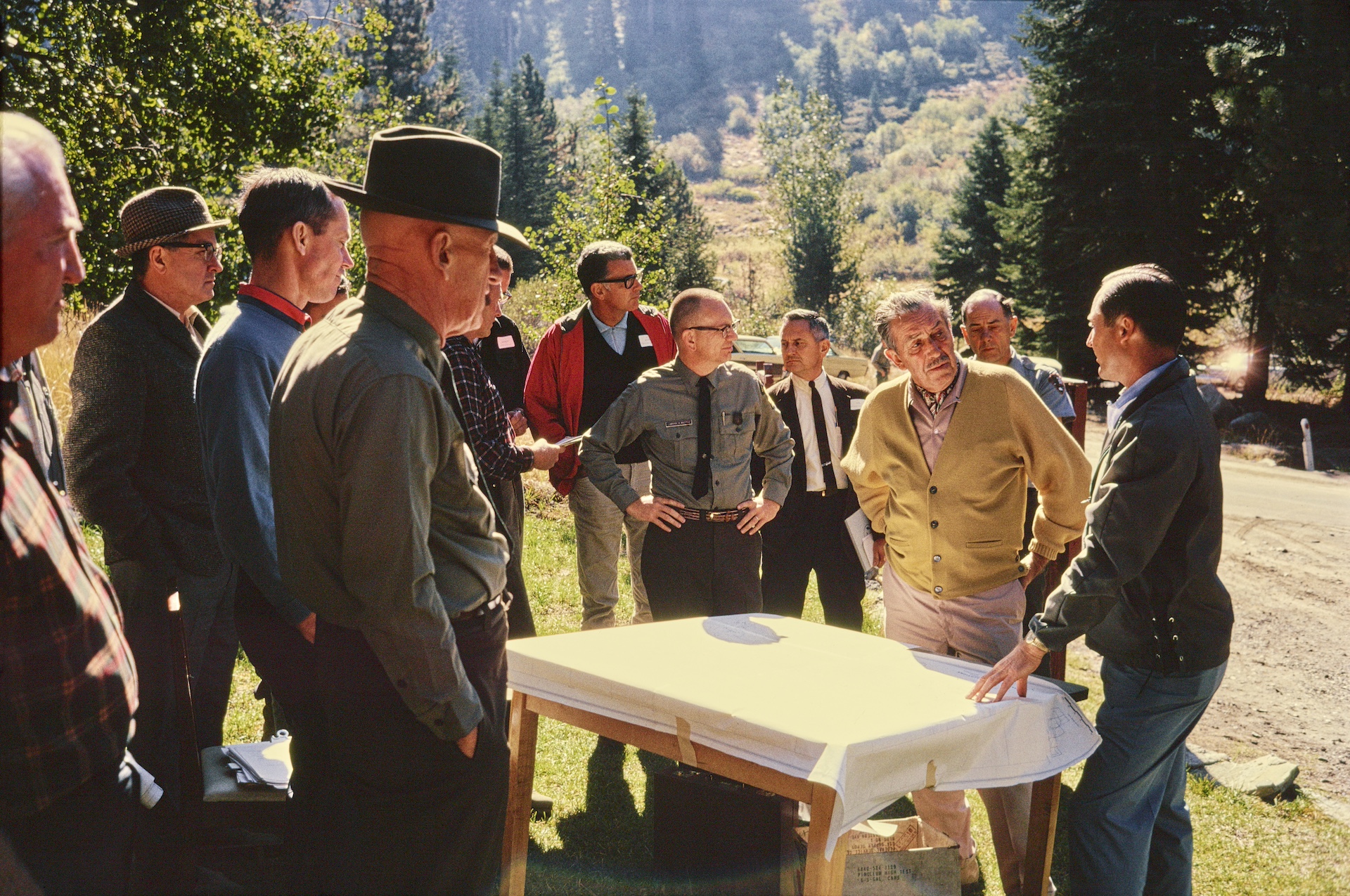 Walt Disney and Mineral King survey team, outdoors in historical photo - History of Country Bear Jamboree