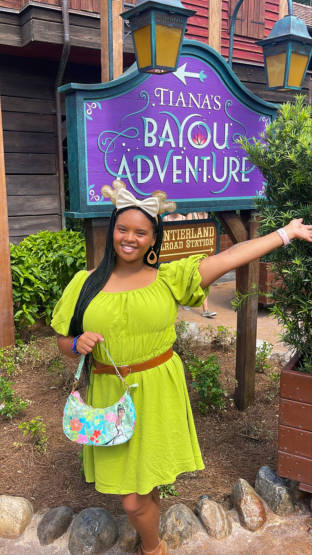 A cast member smiles at the Tiana's Bayou Adventure cast preview