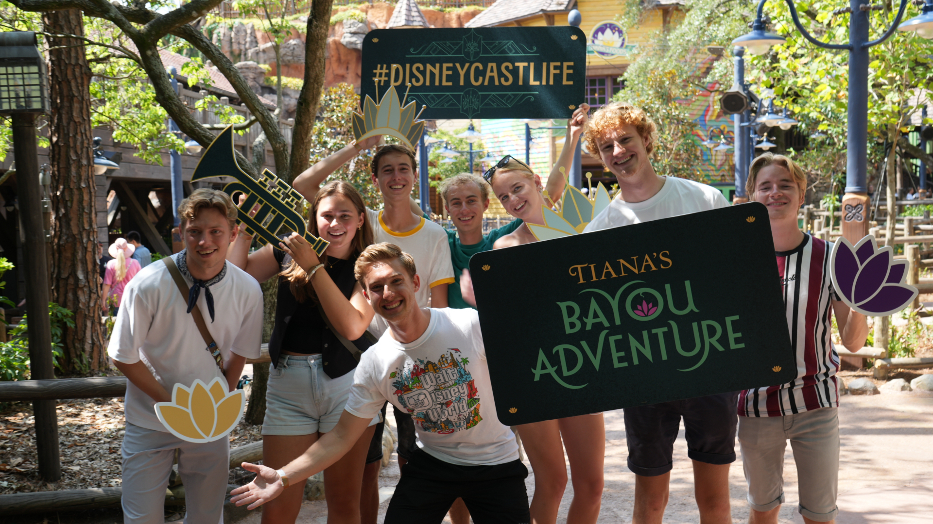 Disney cast members pose at a preview for Tiana's Bayou Adventure