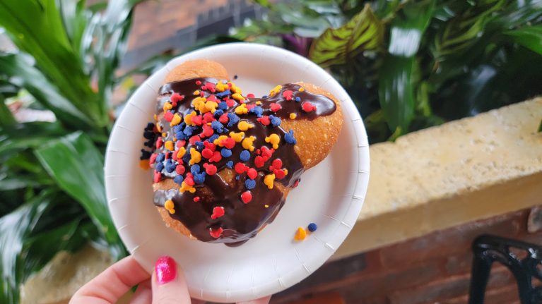 A specialty beignet with chocolate icing 