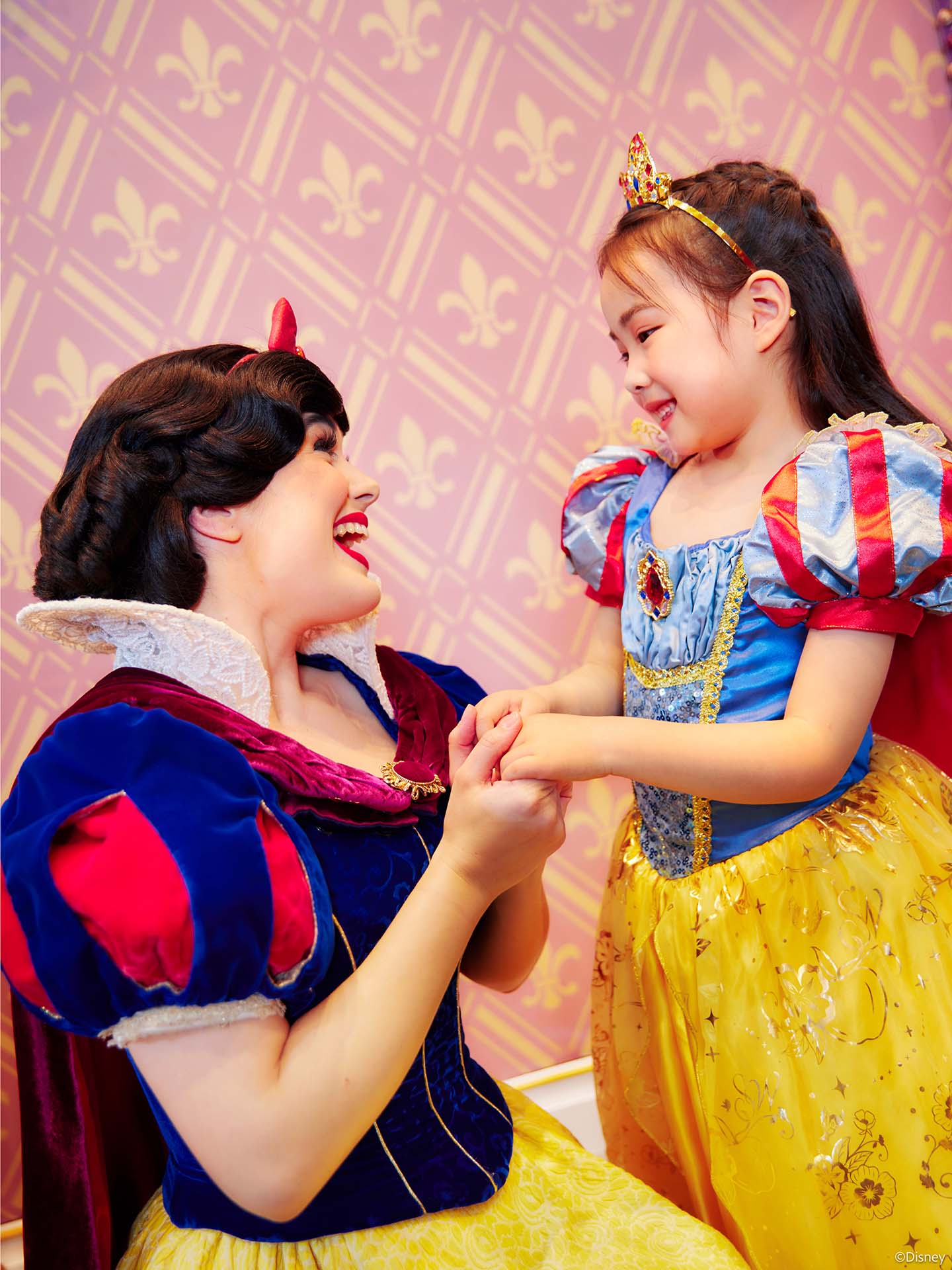 Snow White smiles with little girl