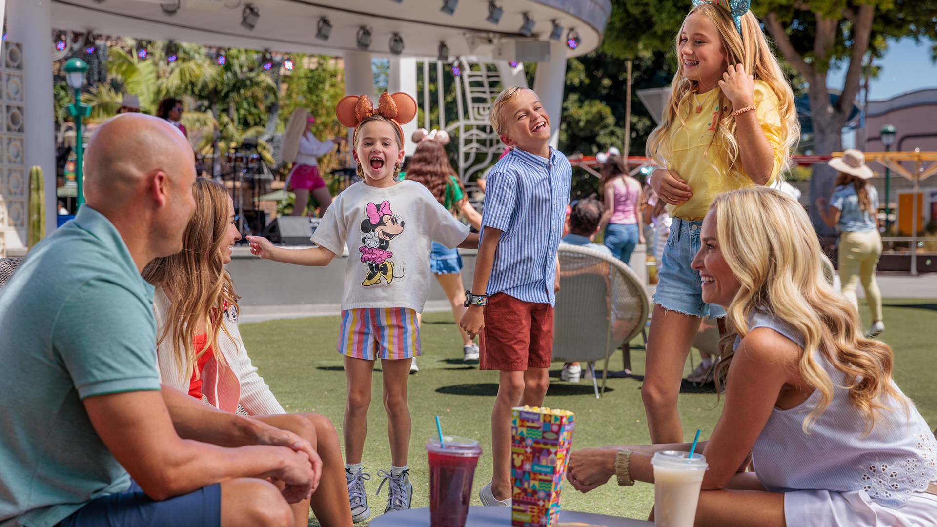 A family enjoys the lawn at Downtown Disney