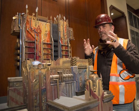 Joe Rodhe beside a model of Guardians of the Galaxy – Mission: BREAKOUT!