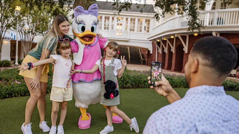 Guests pose for a photo with Daisy