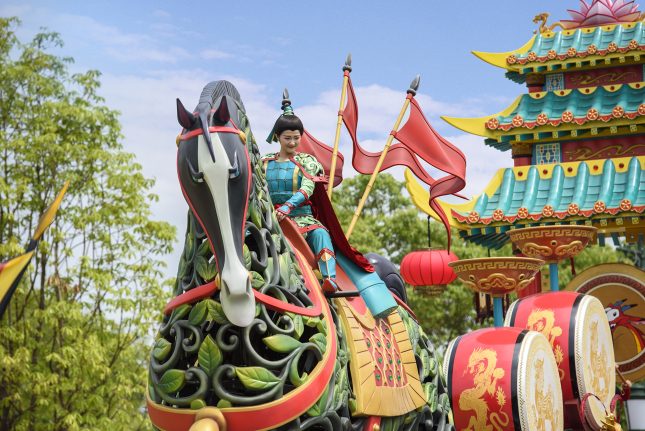 Mulan rides a warhorse in Mickey’s Storybook Express parade at Shanghai Disneyland