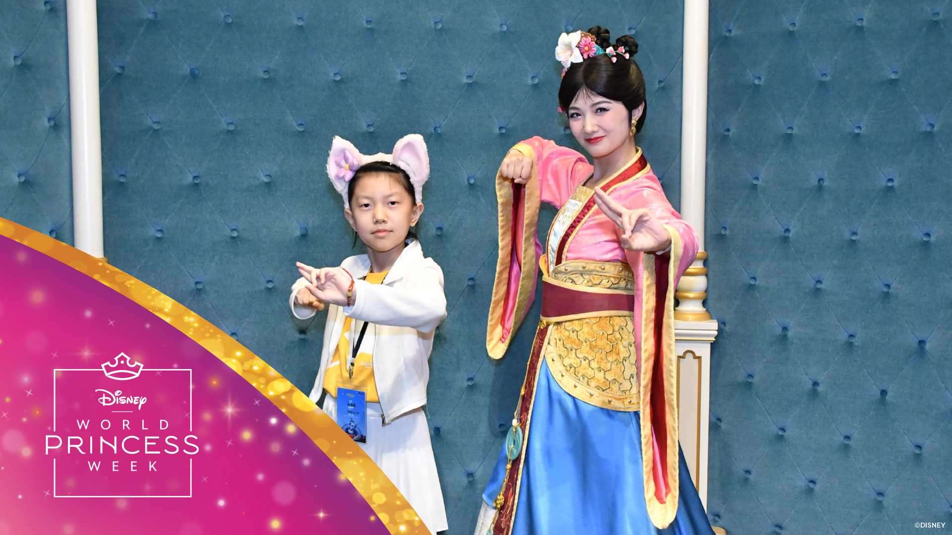 Make-A-Wish child Xuanxuan and Mulan pose together