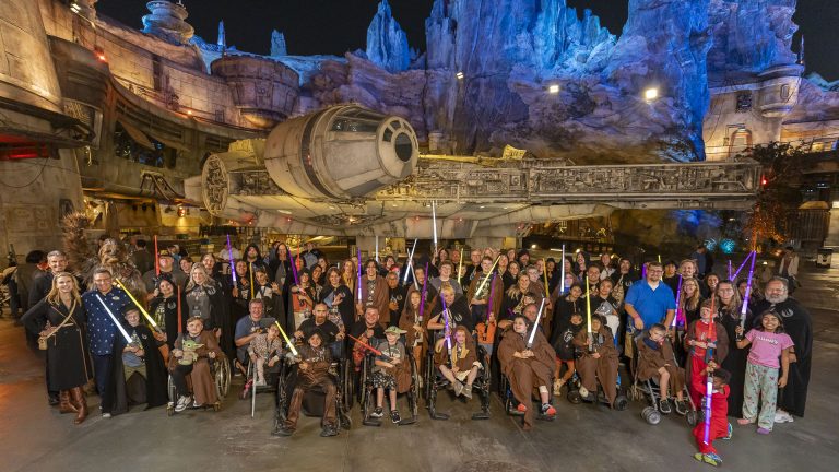 Guests at Blaze Your Path: A Star Wars Adventure pose inside Star Wars: Galaxy's Edge