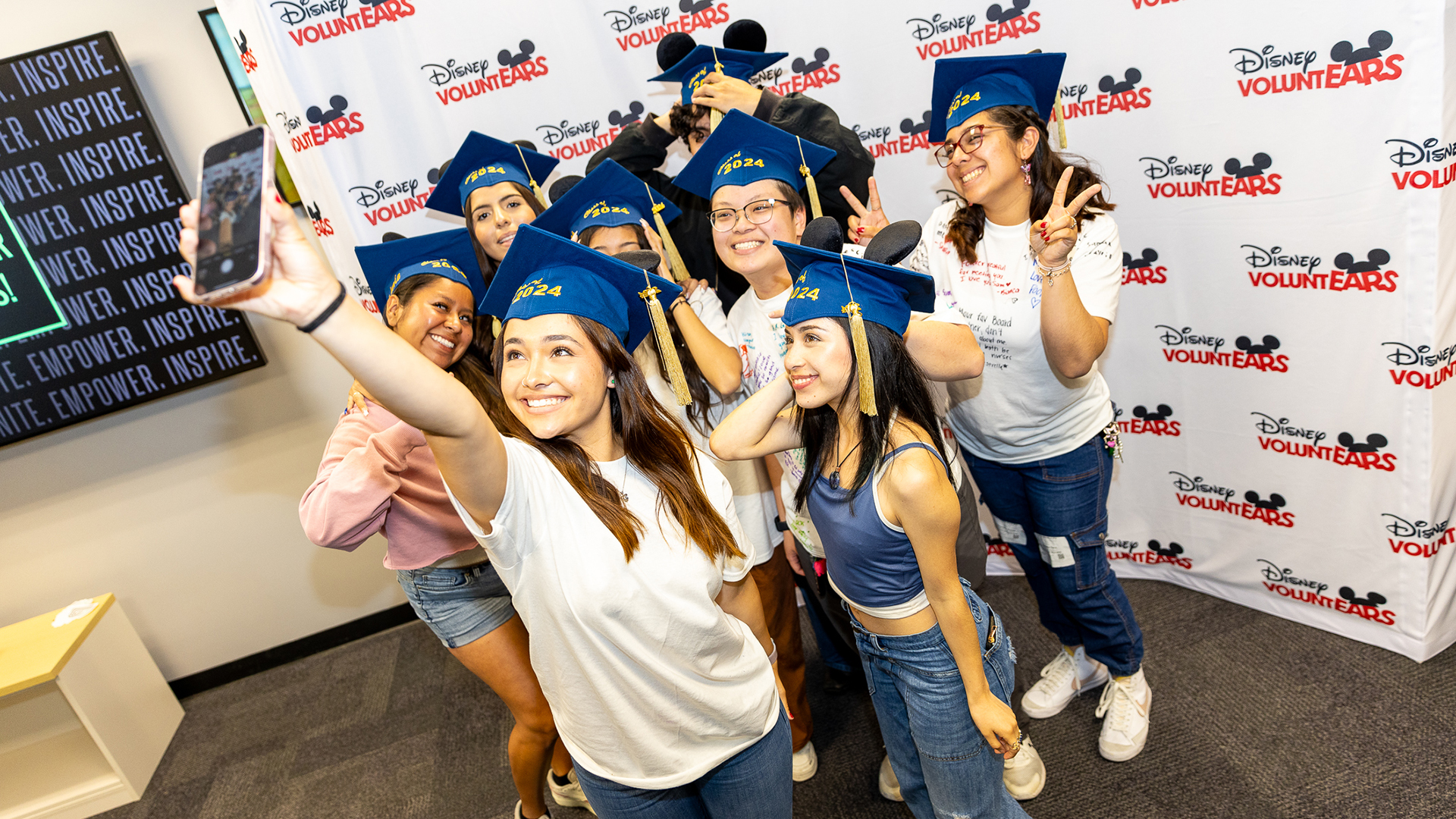 Disney VoluntEARS and mentees pose for a selfie