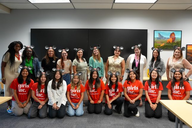 Disney VoluntEARS pose with mentees from the Anaheim Union High School District