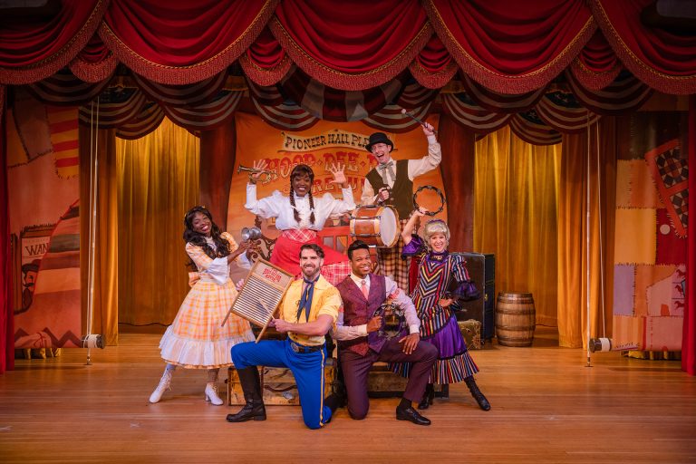 The Hoop-Dee-Doo Musical Revue cast poses onstage