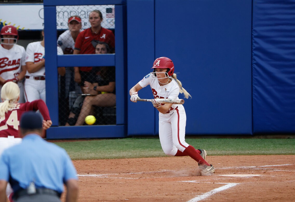 Alexis playing softball in college