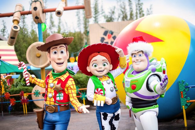 Woody, Jessie, and Buzz in holiday attire at Disney's Hollywood Studios