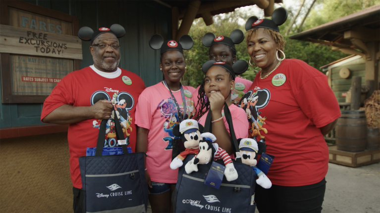 Jackie smiles with her family at Walt Disney World