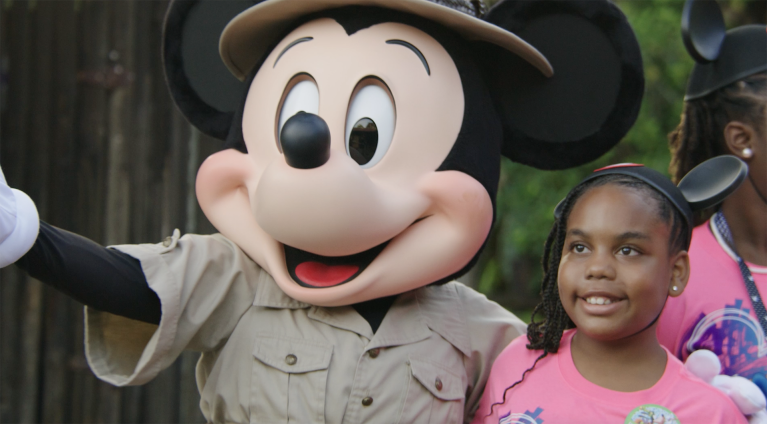 Adventurer Mickey Mouse poses with Jackie's family