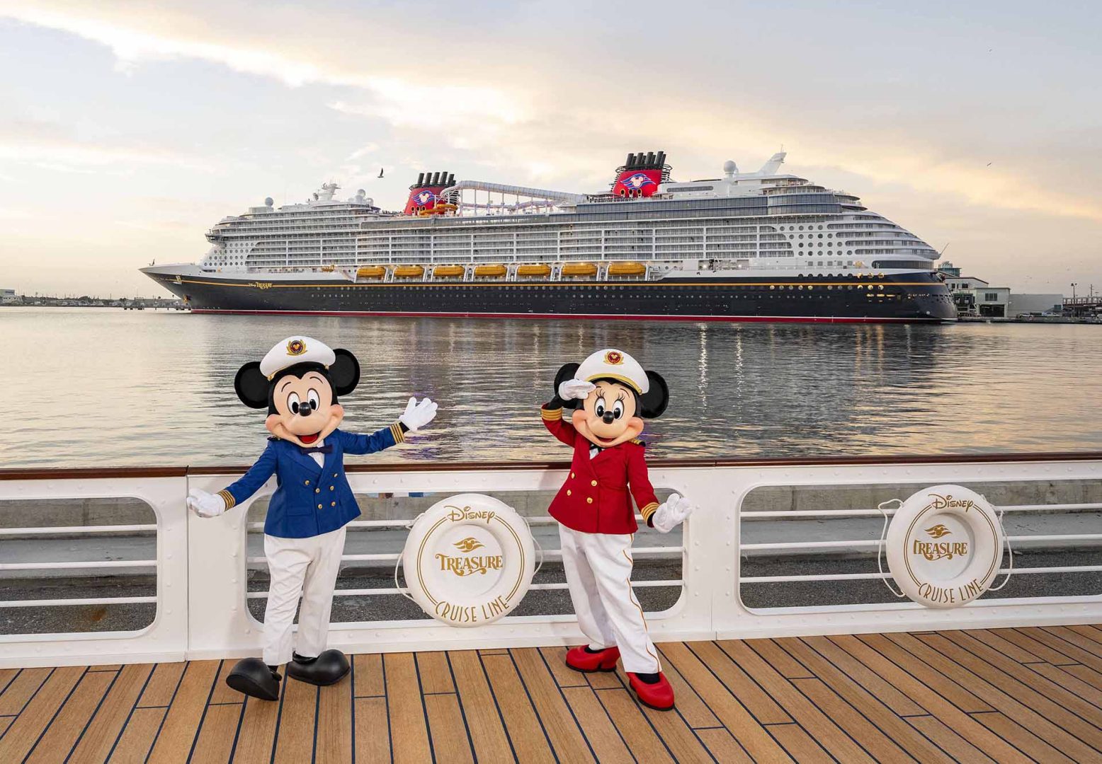 Mickey and Minnie pose with the Disney Treasure at Port Canaveral