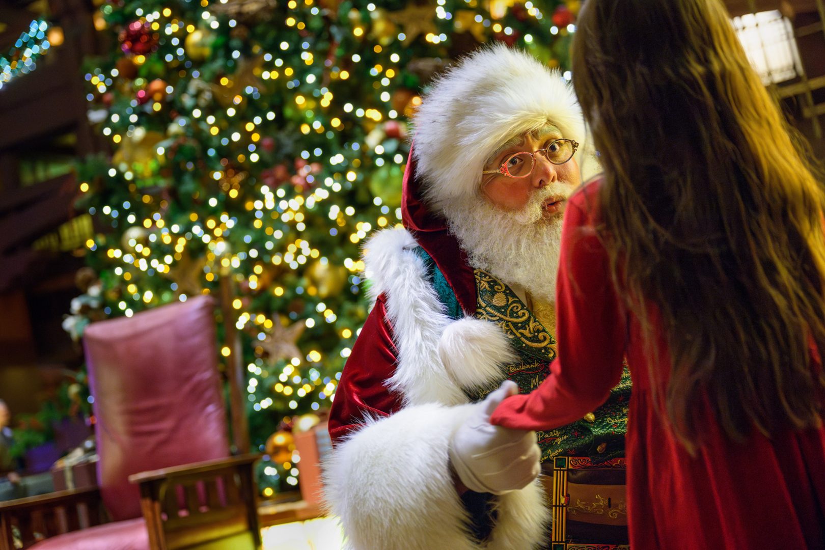 A guest meets Santa Claus at Disneyland Resort