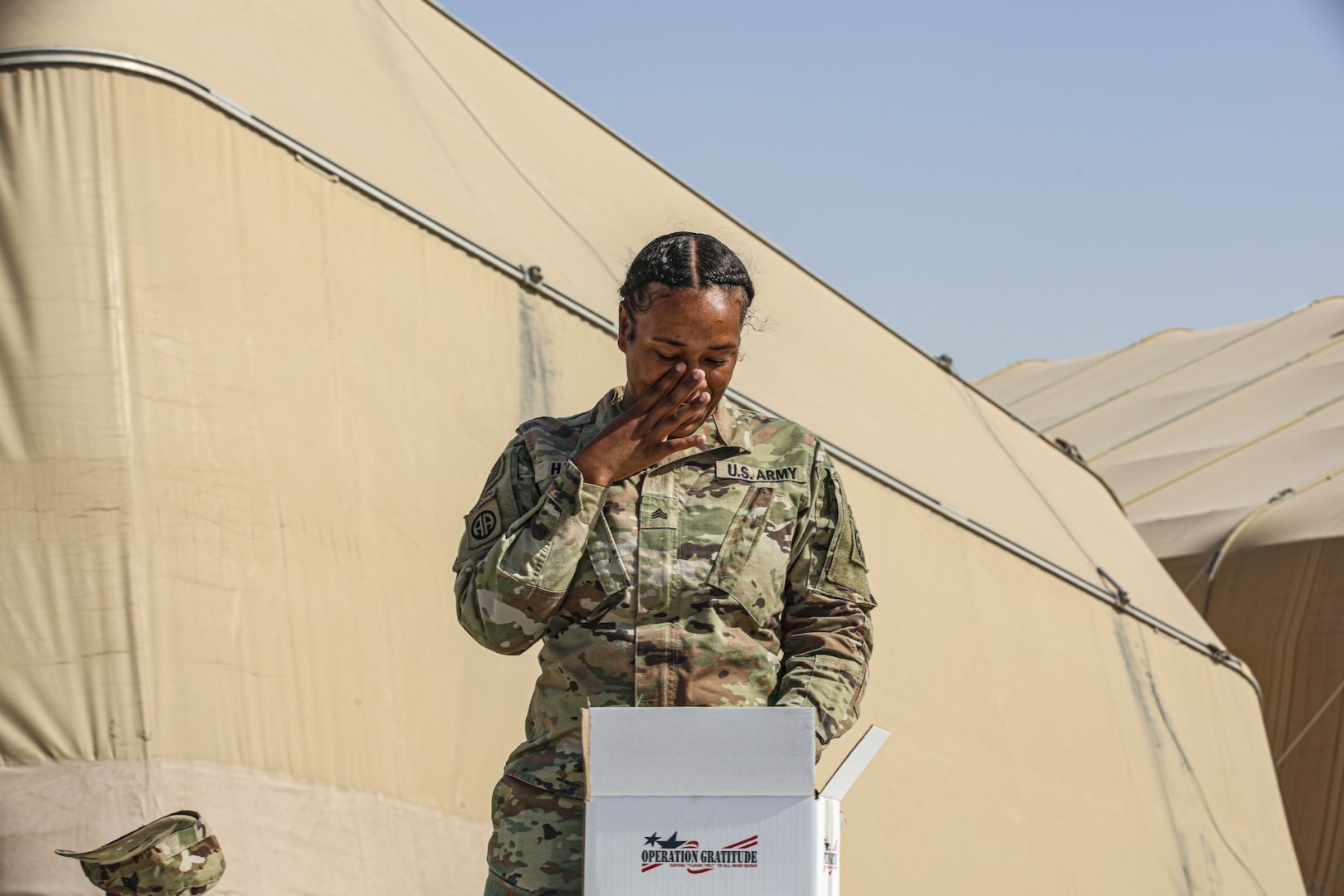 U.S. Army Sgt. Lamari Harris moved to tears after opening the 4 millionth Operation Gratitude care package in Southwest Asia on June 8, 2024, after serving months in the region while deployed with the 82nd Airborne Division. (Photo Credit: SSG Catessa Palone & SGT Vincent Levelev – 82nd CAB Public Affairs)