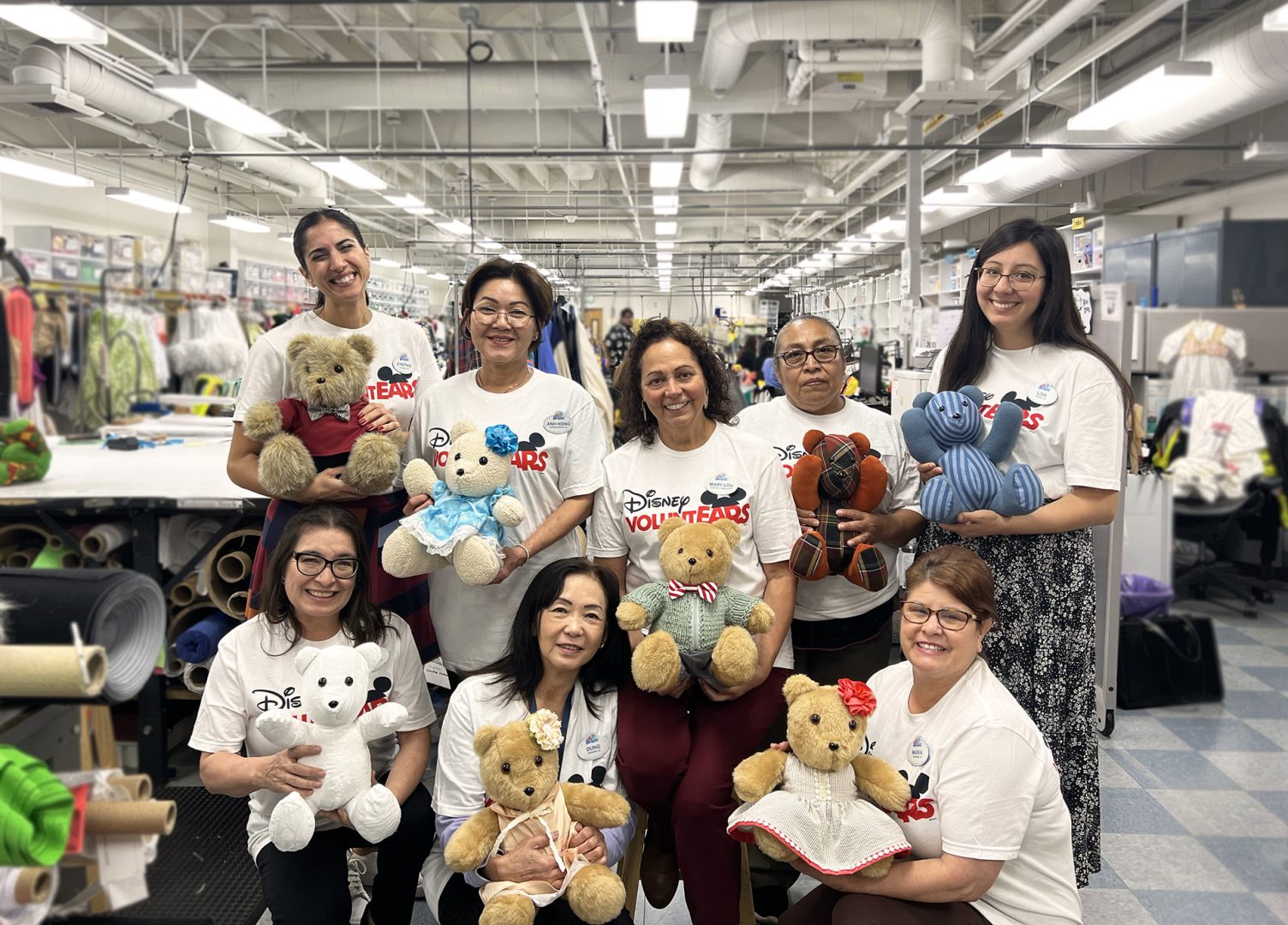 Disney VoluntEARS pose with their bears, ready to donate to the Disney Ultimate Toy Drive 