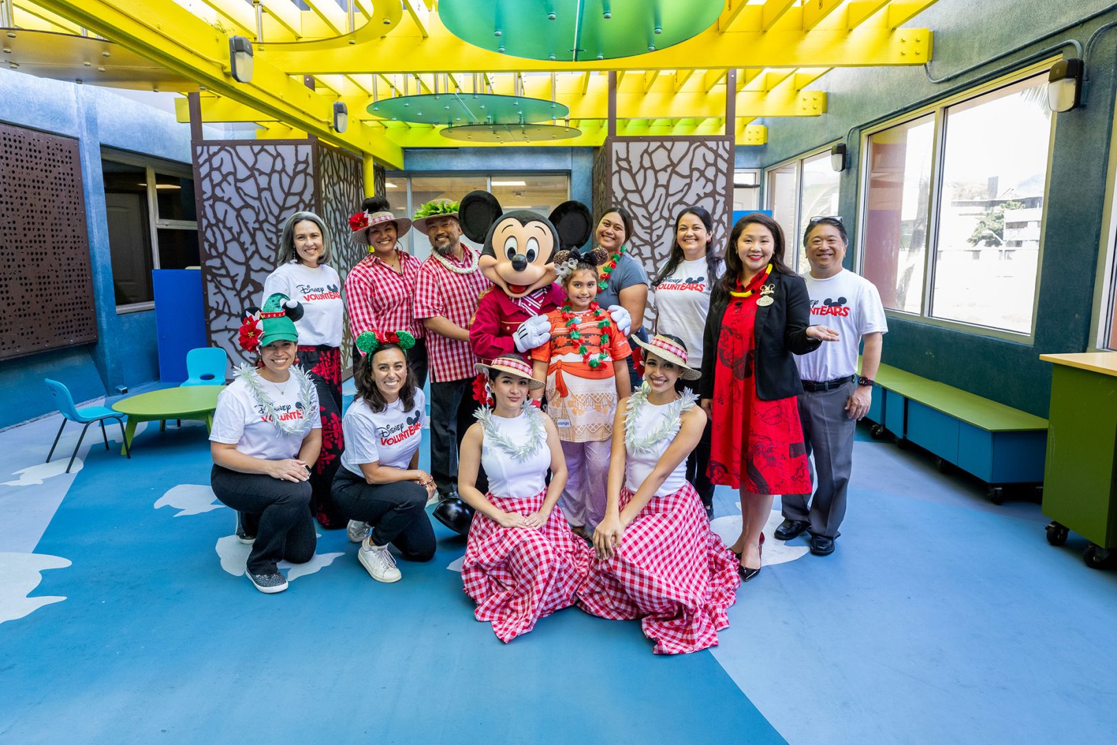 Mickey Mouse poses with VoluntEARS at Kapi‘olani Medical Center for Women & Children