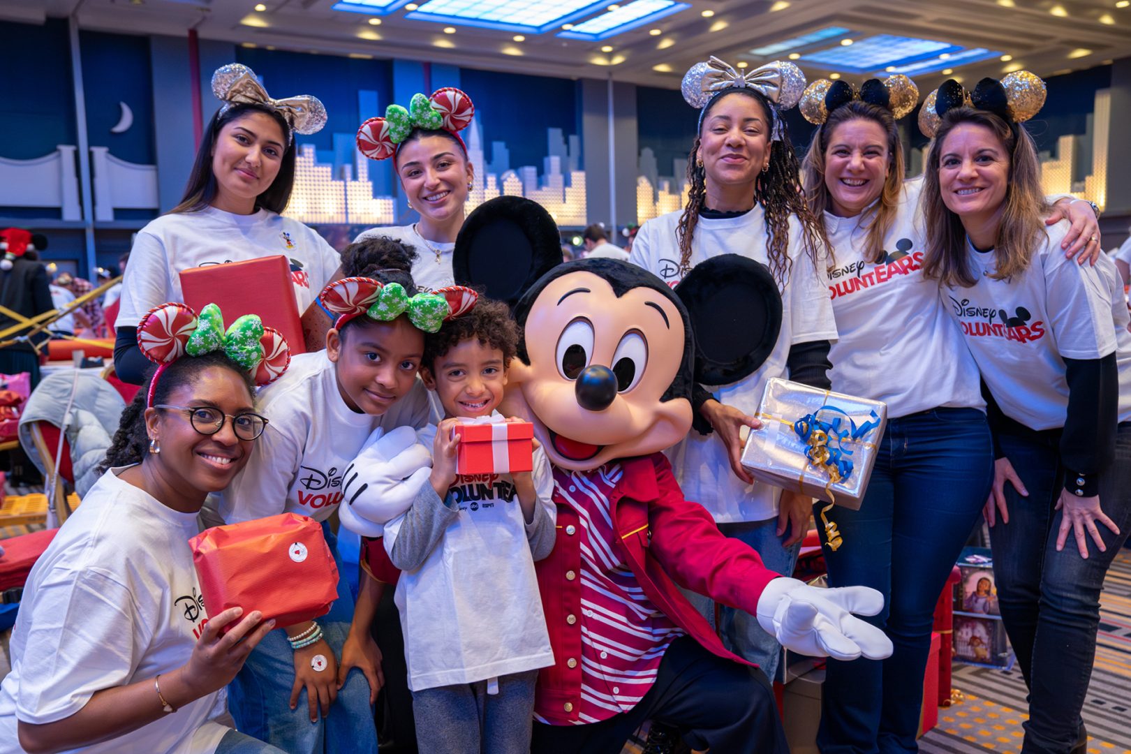 Mickey poses with Disney VoluntEARS 