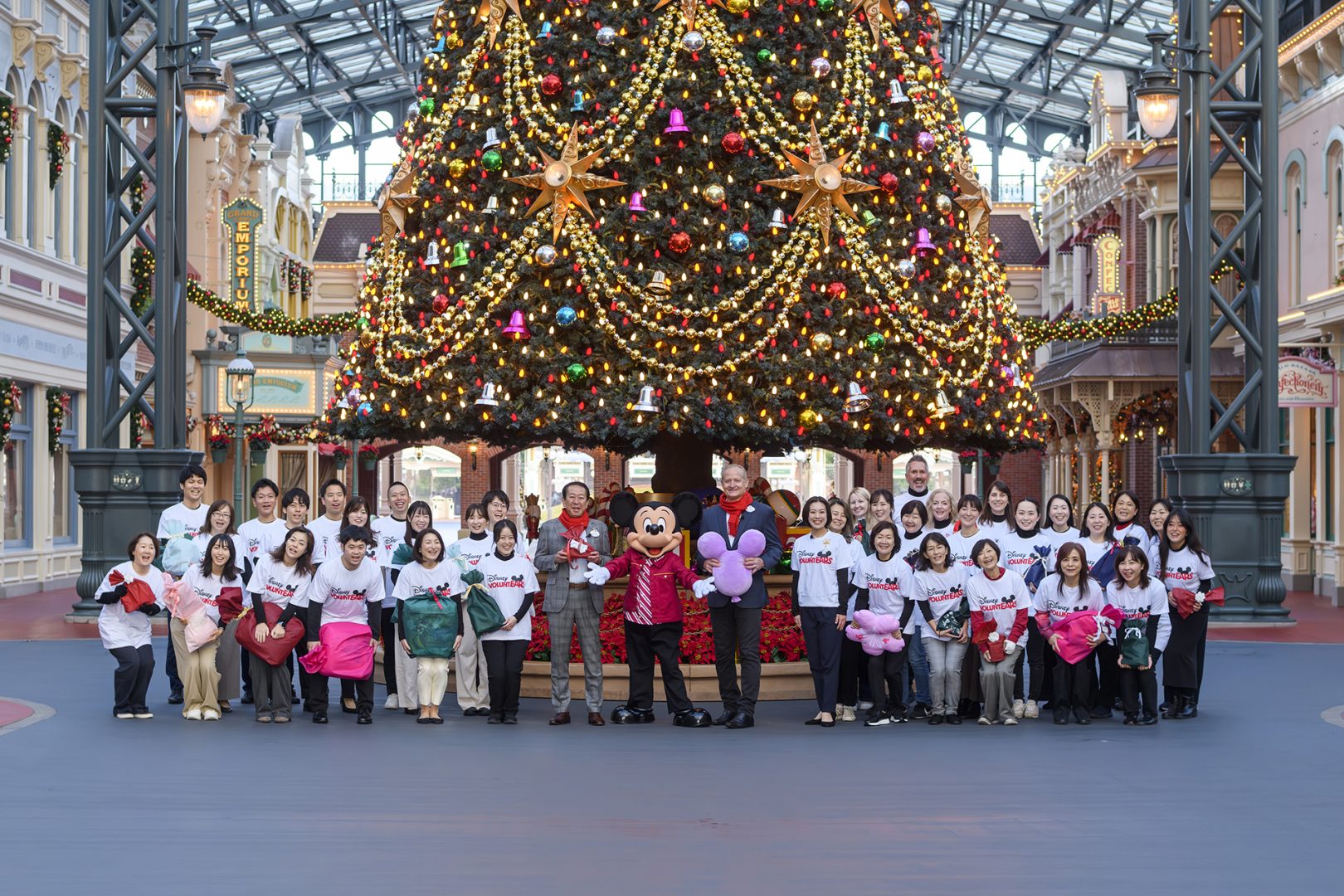 Mickey Mouse poses at Tokyo Disney Resort with Disney VoluntEARS