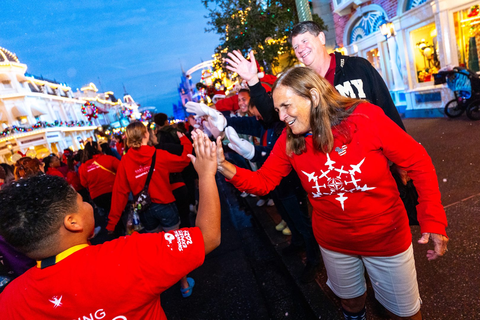 Virginia high fives a guest at Snowball Express