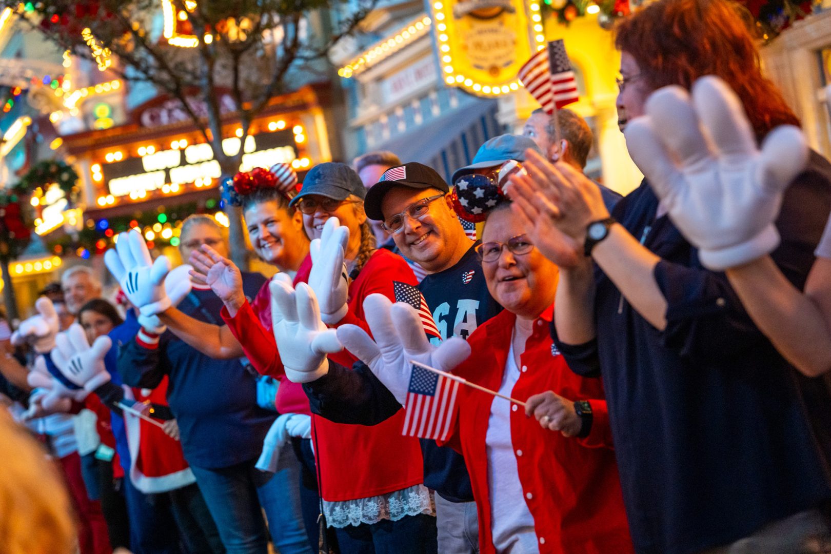 Cast members cheer for families on Main Street, U.S.A.