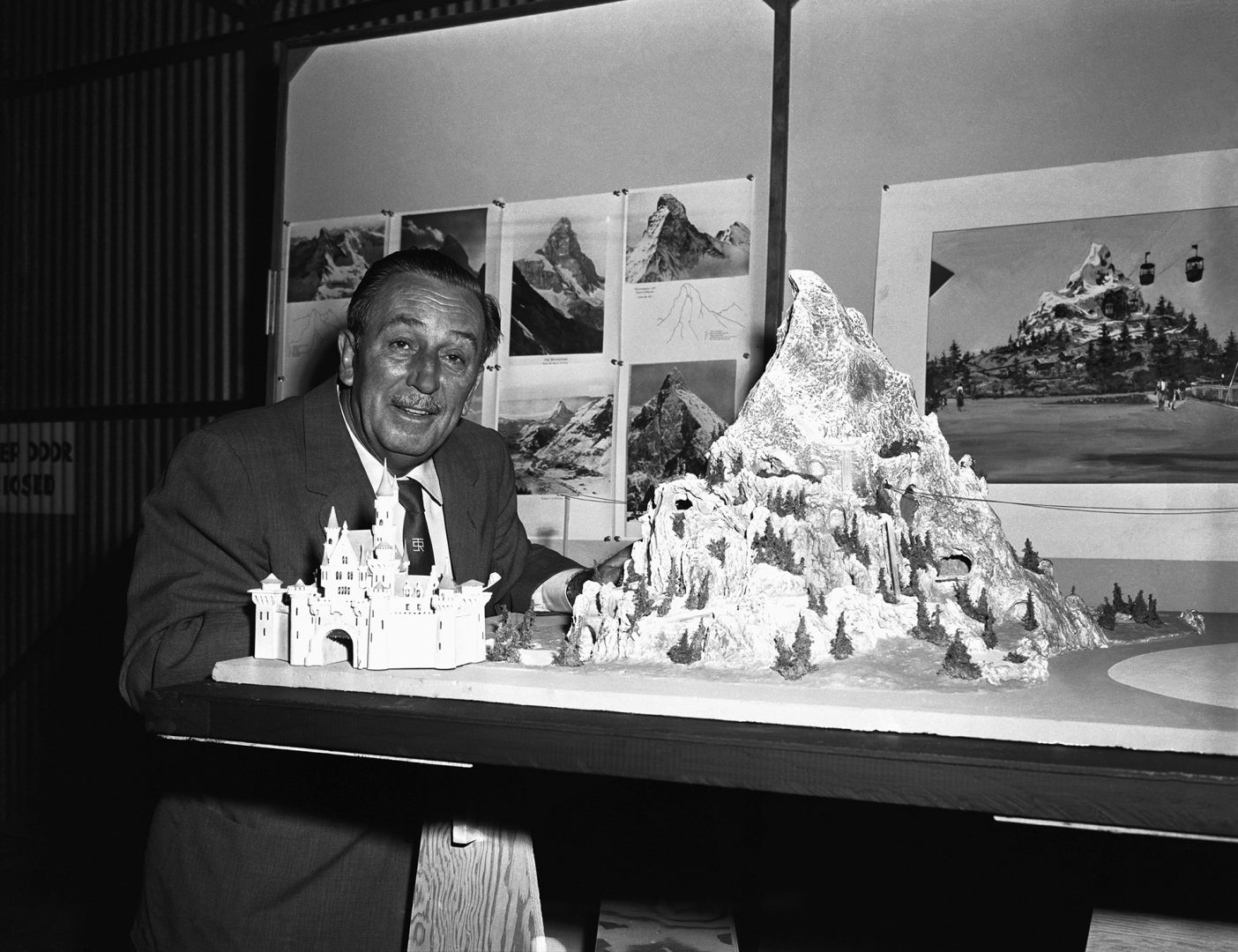 Historical image of Walt Disney with a model of Matterhorn Bobsleds