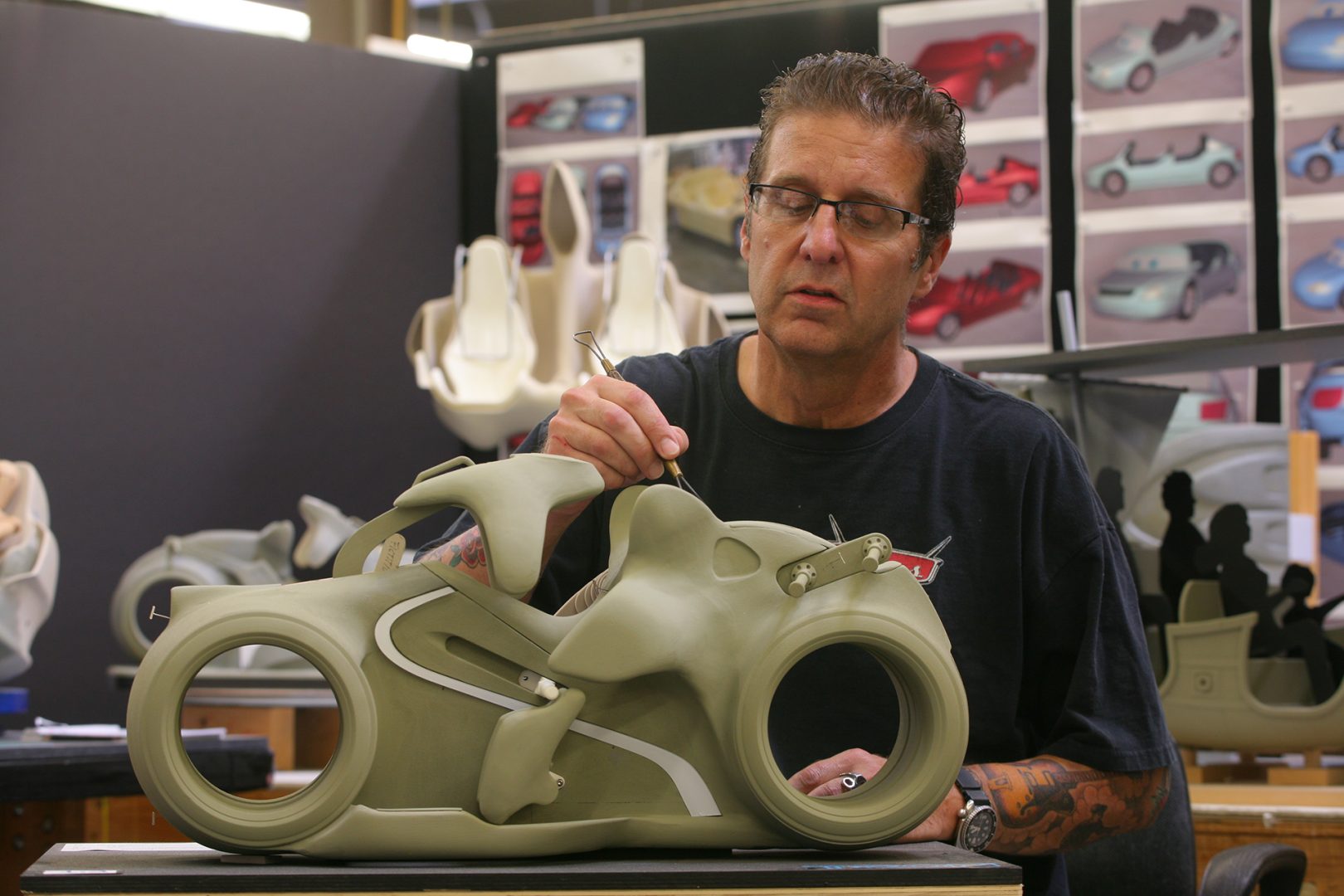 An Imagineer works on a model for TRON Lightcycle Power Run at Shanghai Disneyland Resort