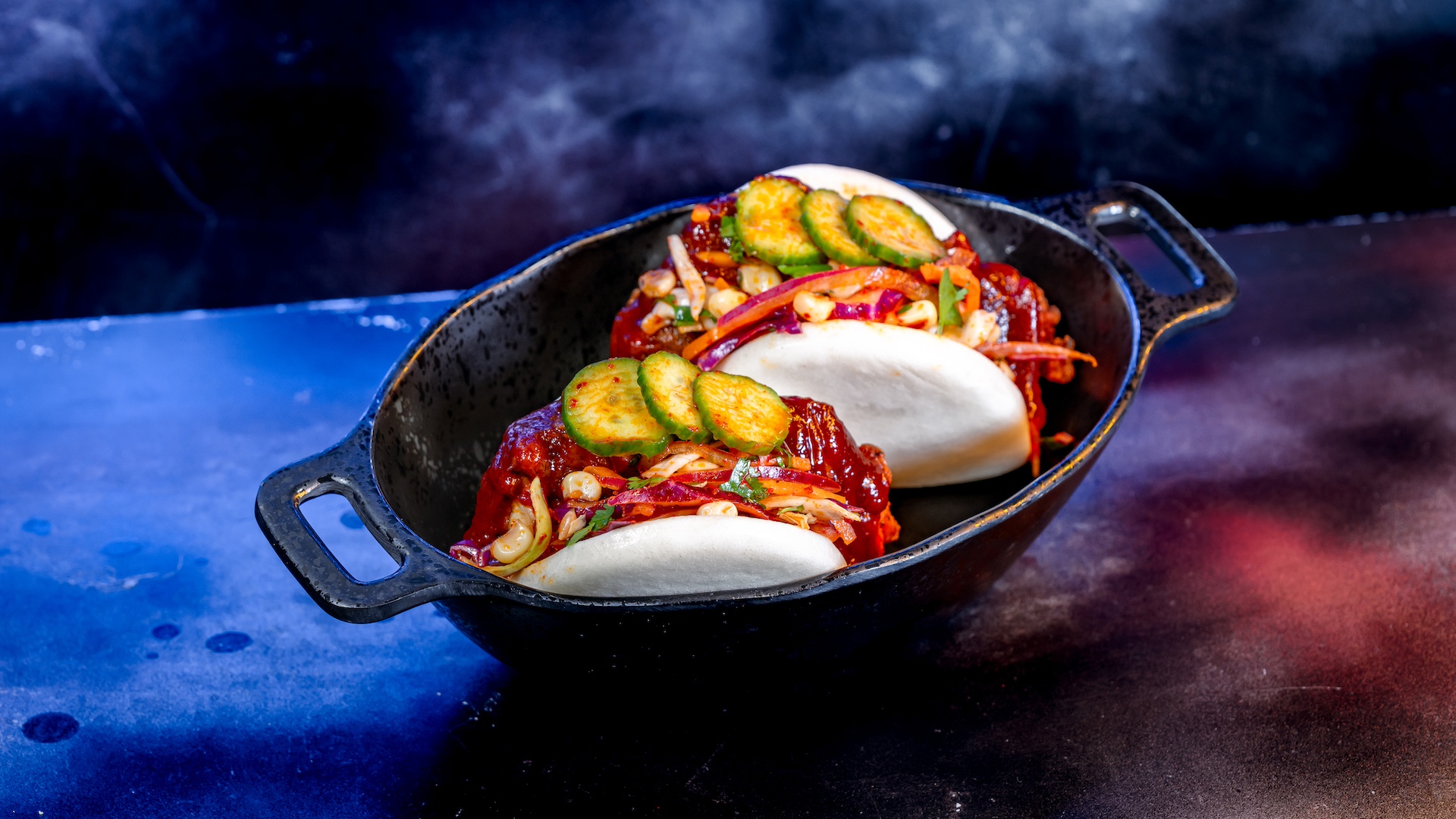 •	Fried Chicken Baos: Two crispy chicken baos, sweet chili sauce, scallion salad, and cucumber coins