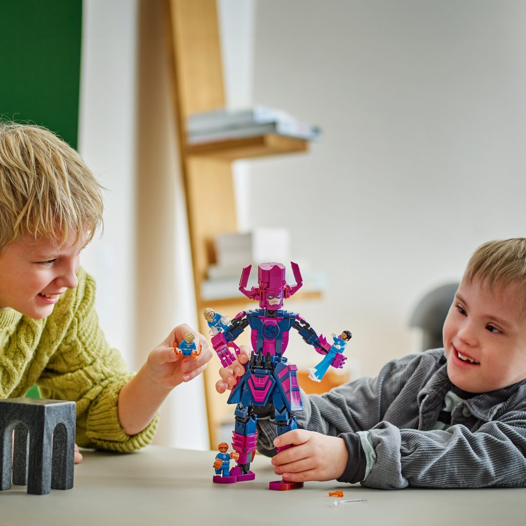Children playing with LEGO Fantastic Four set