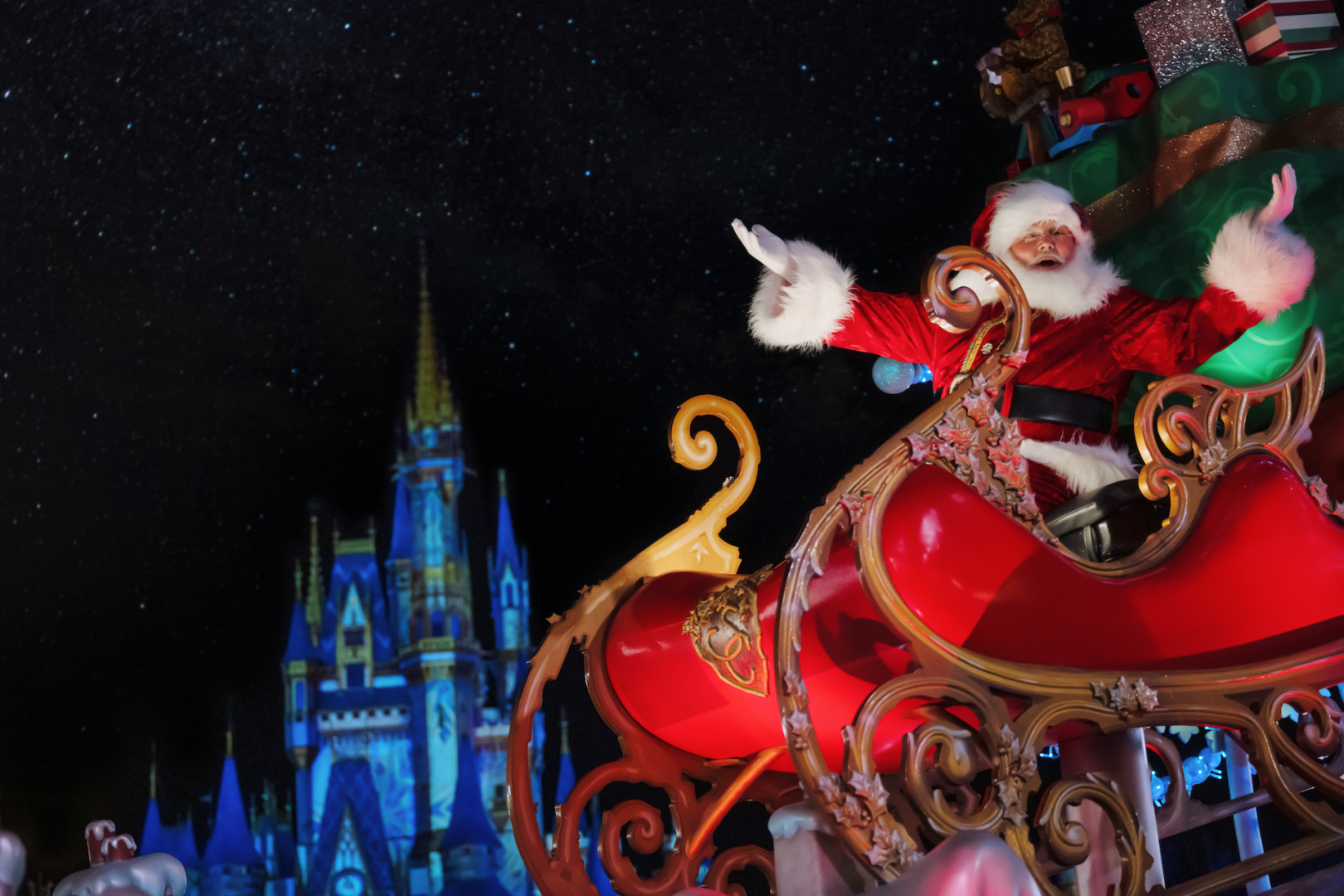 WDW Santa Claus riding sled down Main Street in front of Cinderella Castle