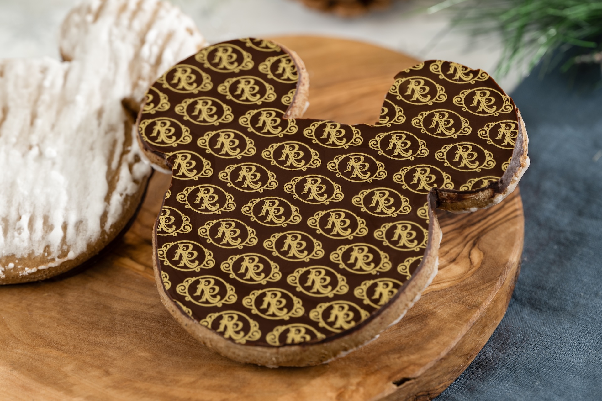 Gingerbread cookie shaped like Mickey Mouse with decorative icing.