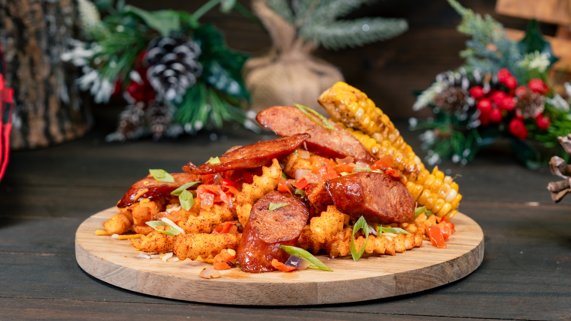 Spicy Cajun Loaded Fries: Cajun fries topped with hot links, cheddar cheese, corn, and bell peppers (New)