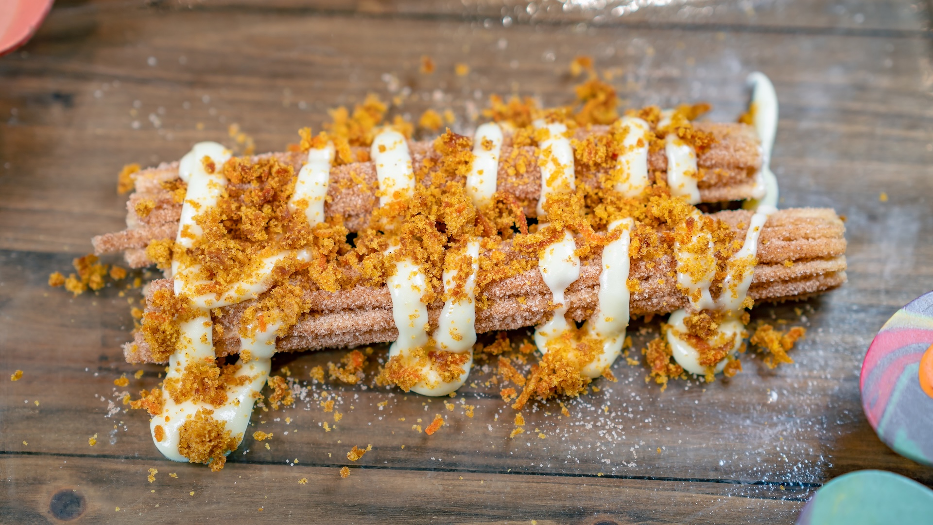 Carrot Cake Churro: Classic churro topped with carrot cake pieces and cream cheese 