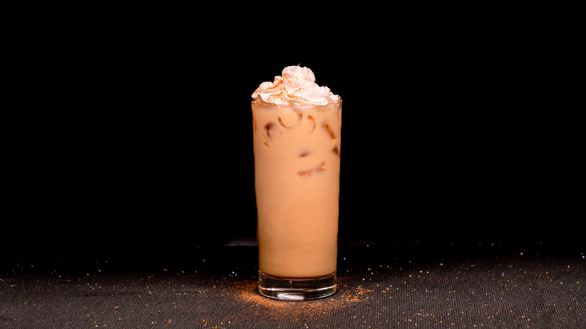 Chai Ginger Latte: Espresso, milk, chai syrup, white chocolate sauce, and gingerbread whipped cream (Non-alcoholic) (Available hot or iced) 