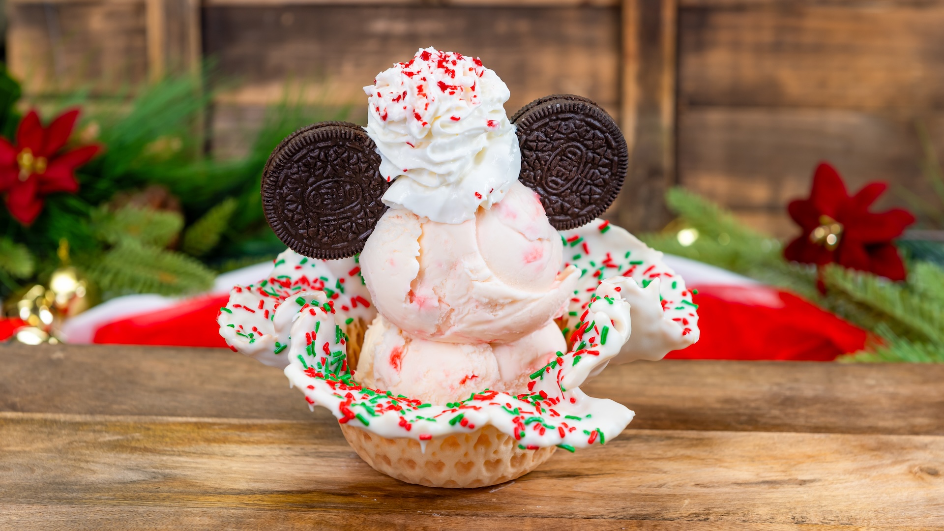 Peppermint Holiday Sundae: Two scoops of peppermint ice cream with whipped cream, crushed peppermint, and crème-filled cookies in a candy-topped waffle bowl 