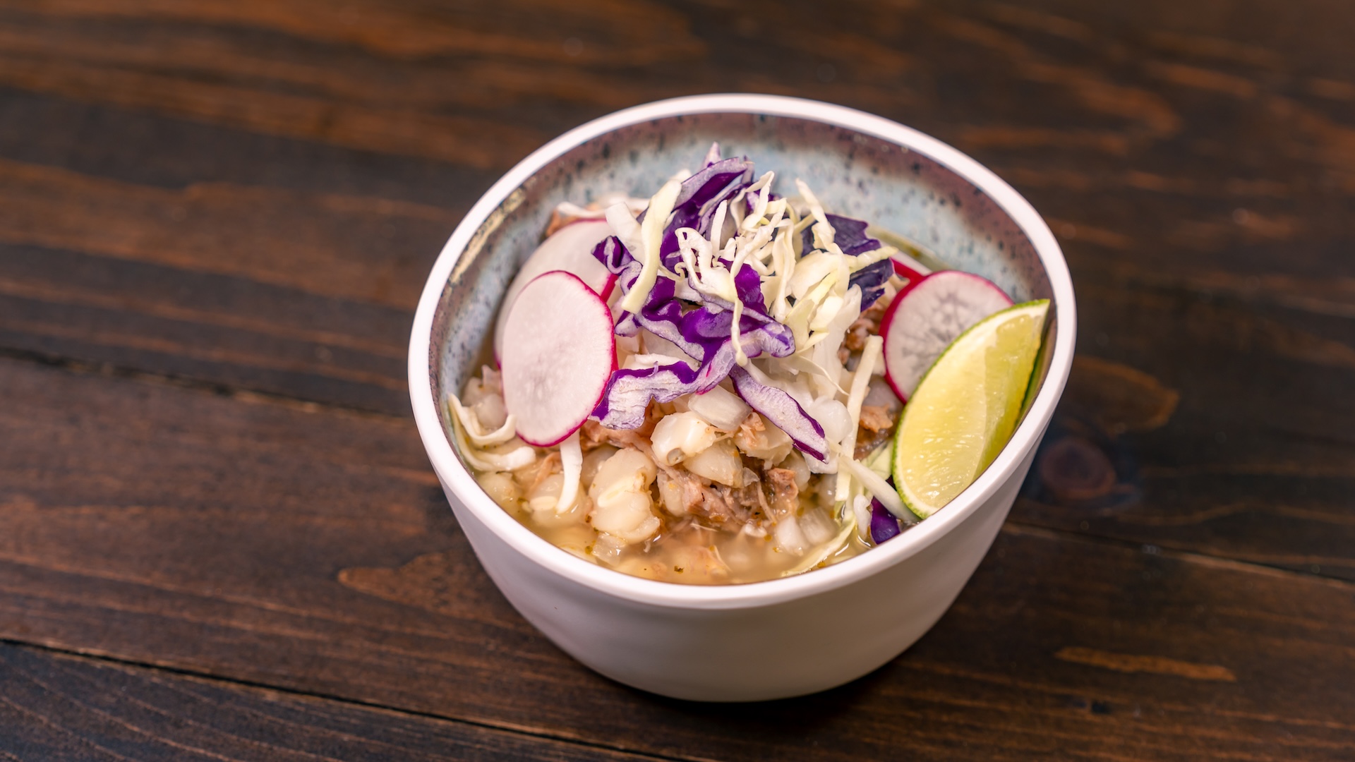Pozole Blanco: Pork pozole, onions, cabbage slaw, lime wedge, and sliced radish, served with corn tortilla chips (New) 