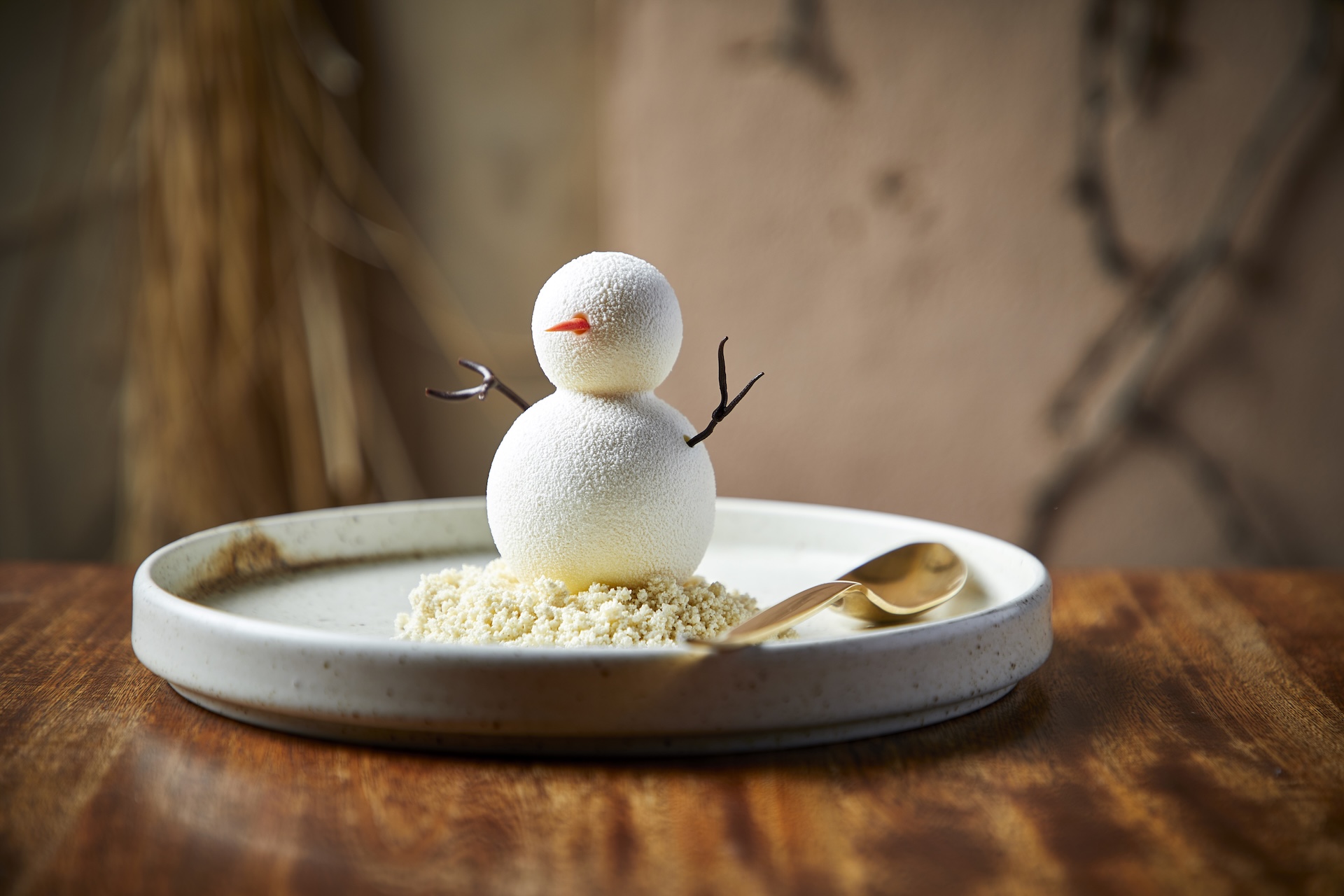 Snowman: Cardamon cake, orange mousse, orange peel gel, coconut streusel, rosemary, and gruyère ice cream 